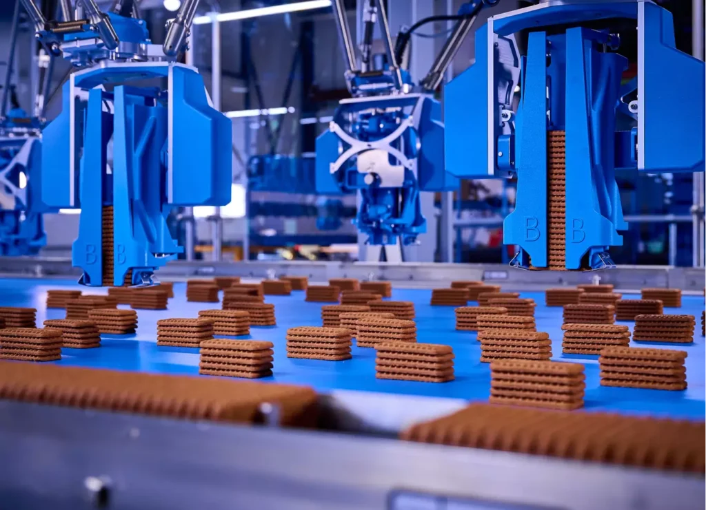 Picking cookies straight from the oven into packaging